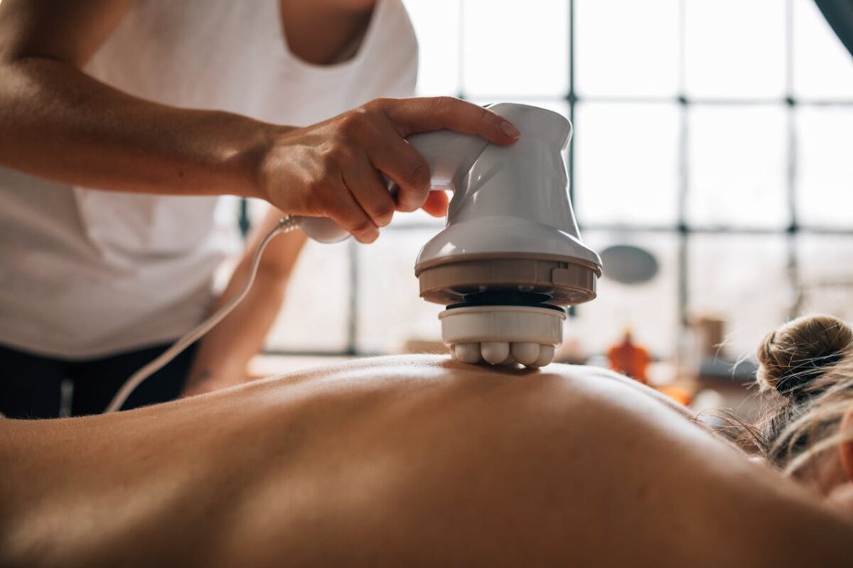 why-choose-us A serene body massage session with an electronic massager promoting relaxation.